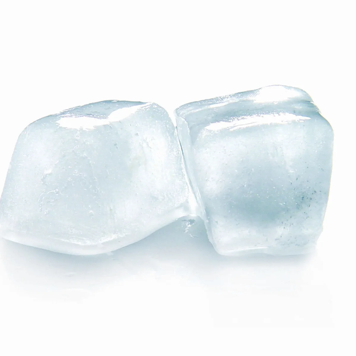 Two clear ice cubes on a white reflective surface